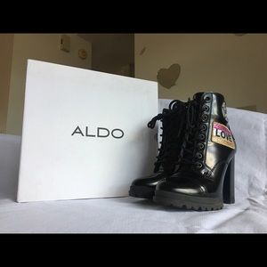 Black ALDO boots with patches on sides